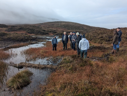 Simon showing farmers peatland restoration techniques at Cuilcagh 